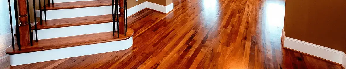 Base floor of a staircase with professionally restored wood flooring in Wilmington NC