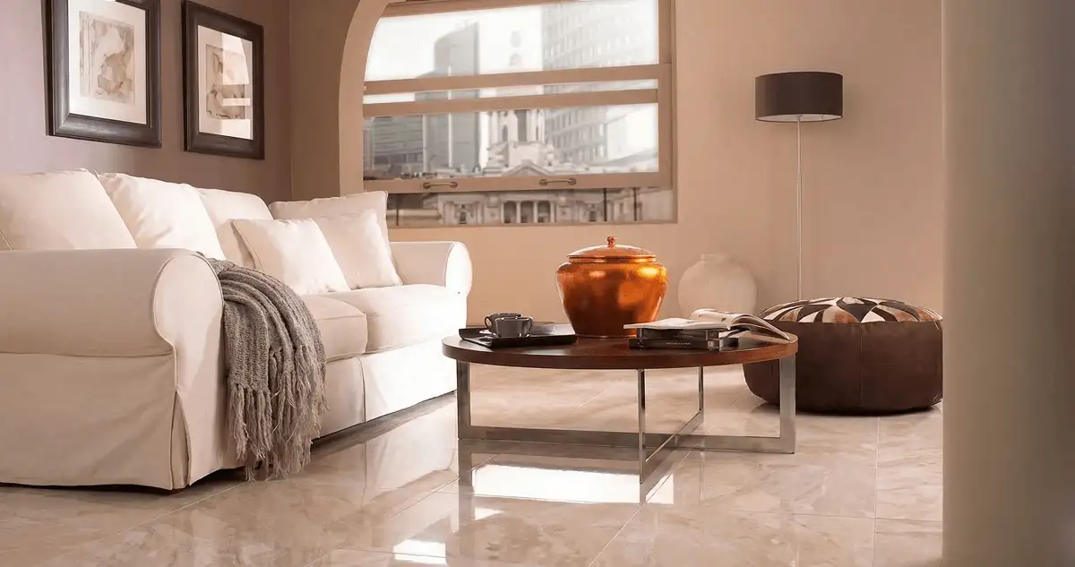 Modern living room with professionally installed marble flooring, a beige sofa, coffee table in Wilmington, NC