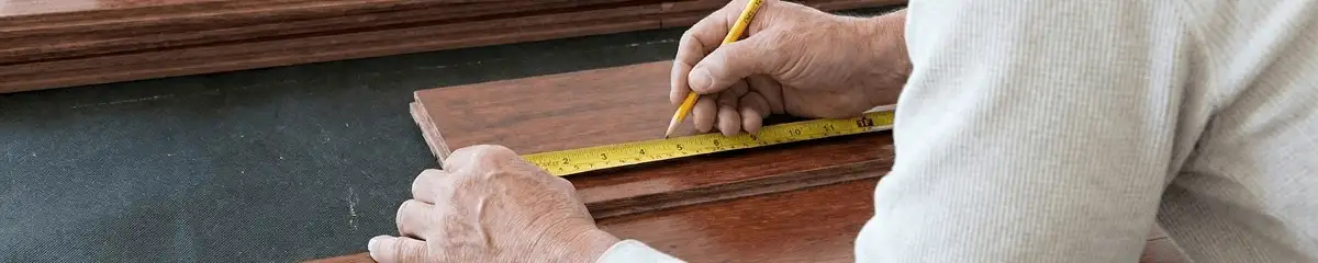 A professional installing wood flooring in Wilmington, NC